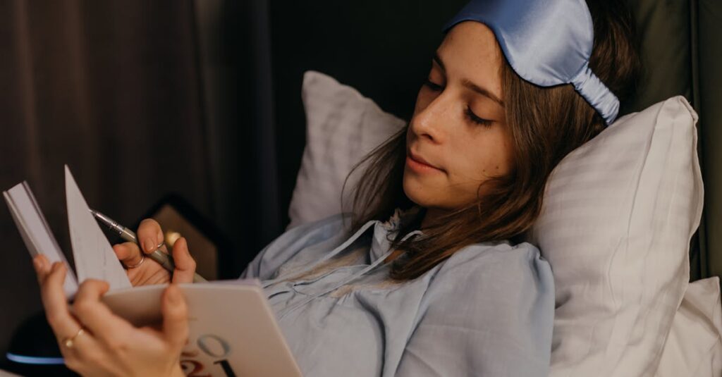 Woman writing in a journal, representing reflective support for perimenopause and menopause.